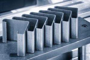 Metal products bent on a bending machine. Factory made products. Industrial concept background.